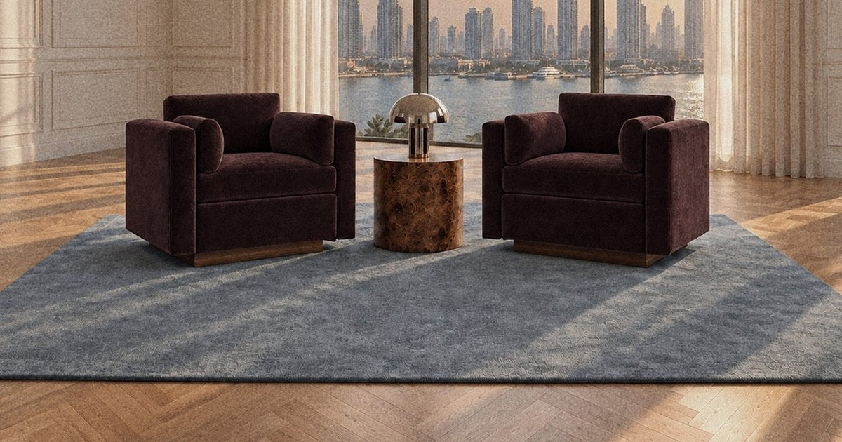 L Ecrin armchairs in aubergine facing a Dubai skyline, Saint Objets